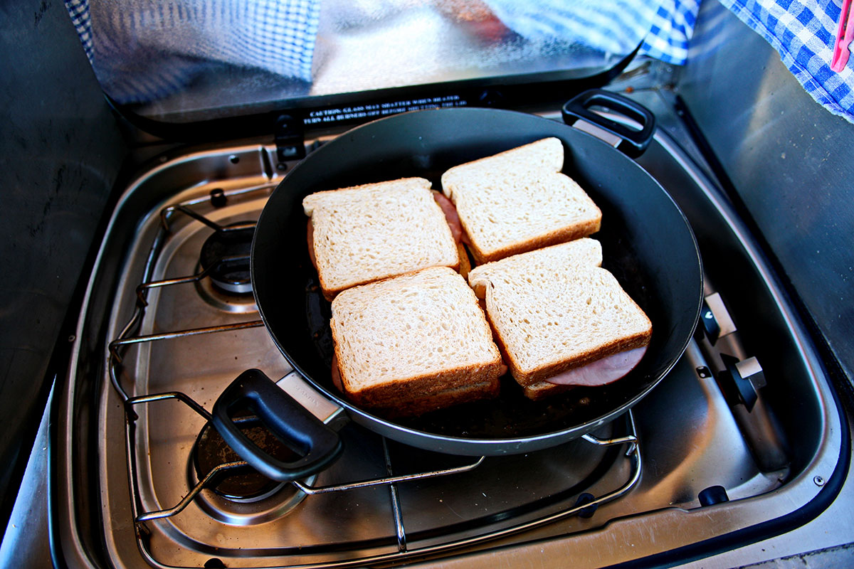 sandwiches on a pan being grilled